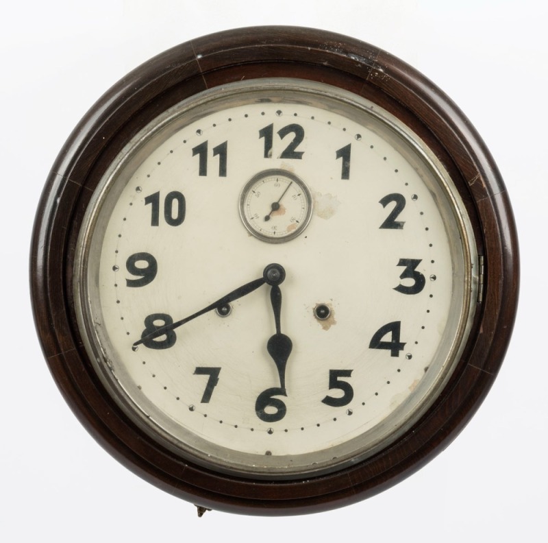 An antique American wall clock in timber case with time and strike movement, Arabic numerals and subsidiary dial, 19th century, ​​​​​​​42cm diameter overall