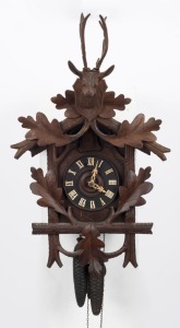 A Black Forest cuckoo clock with carved deer pediment, 19th/20th century, 70cm high overall