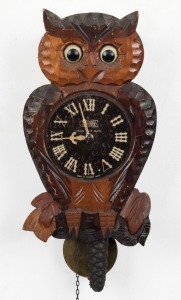 A vintage Japanese owl moving eye wall clock, mid 20th century, 27cm high