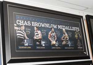Geelong Football Club signed Brownlow official print with replica Brownlow Medal (limited edition #22 of 200) signed by Alistair Lord, Paul Couch, Jimmy Bartel, and Gary Ablett Jnr. Official AFLPA COA included. Framed: 56 x 104cm.