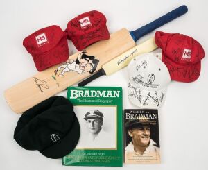 A full-size cricket bat with an original illustration of Len Pascoe in his bowling stance, signed by Pascoe and the artist "Harv". With a plaque describing Pascoe's Test career. Accompanied by a miniature bat signed by Keith Stackpole, a green cap signed by Pascoe, 4 caps signed by numerous cricketers and two books on Bradman. (9 items). Note: All the above items were donated to the 1999 MS International Cricket Classic fund-raising project.