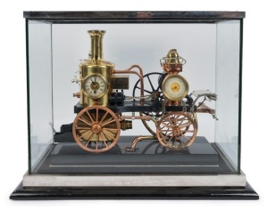 Antique French industrial "FIRE PUMP" clock by GUILMET of Paris, 19th century. Housed in nickel bound display cabinet. Note: Has been electrified with a display light and movement replaced. 36cm high, 43cm deep, the case 46cm high, 61cm wide, 35cm deep