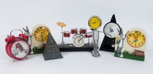Seven assorted novelty clocks including two BUGS BUNNY talking alarm clocks, The Pyramid Annual Ring quartz clock, and others, the largest 24cm high