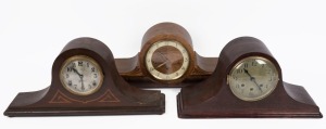Three Napoleon hat timber cased mantle clocks, including two with three train movements, 20th century, the largest 60cm wide