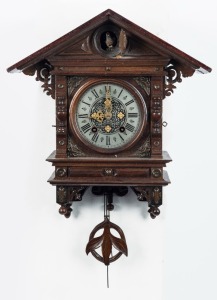 An antique cuckoo wall clock with silvered dial and Roman numerals, early 20th century, 58cm high