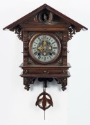 An antique cuckoo wall clock with silvered dial and Roman numerals, early 20th century, 58cm high