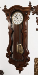 A Vienna regulator wall clock in serpentine timber case, twin weight movement with enamel dial and Roman numerals, 19th century. Note: Unassociated movement. The back plate signed. 110cm high