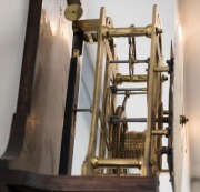 An antique English skeletonized regulator wall clock with deadbeat escapement maintaining power, wood rod pendulum with heavy cast iron bob, one piece painted dial with blued steel&nbsp;spade hands and unassociated brass cased weight, 19th century, custom&nbsp;made - 2