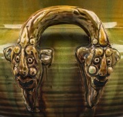 V.A.P. (VICTORIA ART POTTERY) rare pottery jardiniere by WILLIAM FERRY with face mask gargoyle handles, glazed in green and yellow with pink interior, late 19th century, impressed mark "VICTORIA ART POTTERY, W.F.",  19.5cm high, 29cm wide - 2