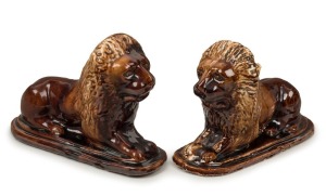 BENDIGO POTTERY lion doorstops with Rockingham glaze, 19th century, 16cm high, 26cm long