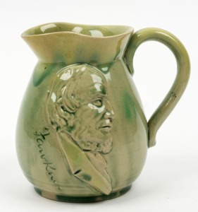 REMUED "Fawkner Souvenir Of Melbourne" green glazed pottery jug, circa 1934,  incised 'Remued", 12cm high 