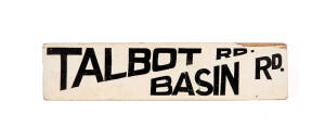 LAUNCESTON TRAM STOP SIGN: &ldquo;Talbot Rd / Basin Rd&rdquo;, tapered black lettering on white-painted timber, 12 x 52cm. A small section missing in upper right corner and minor scuffing but still good condition. Rare!