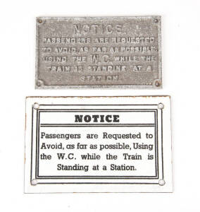 Signs: &ldquo;NOTICE.&nbsp; Passengers are Requested to Avoid as far as possible, Using the W.C. while the Train is Standing at a Station&rdquo;.&nbsp; Two versions of the one sign: 1) embossed grey metal; 2) black lettering on white painted metal.&nbsp; (2 signs)&nbsp;
