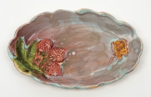 UNA DEERBON platter with applied strawberries and butterfly, incised "Deerbon", 23.5cm wide