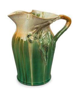 REMUED green and cream glazed pottery jug with applied branch handle, gumnuts and leaf, incised "Remued 54/8M", 25cm high