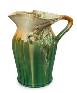 REMUED green and cream glazed pottery jug with applied branch handle, gumnuts and leaf, incised "Remued 54/8M", 25cm high