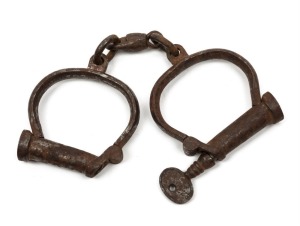 Convict handcuffs with original key, 19th century, ​​​​​​​24cm wide