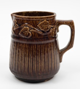 BENDIGO POTTERY brown glazed jug with leaf decoration, ​​​​​​​14cm high