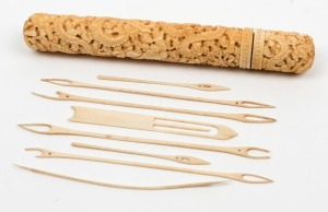 An antique Cantonese carved ivory needle case with fitted lid, containing eight ivory needles. 19th century, ​​​​​​​16cm high