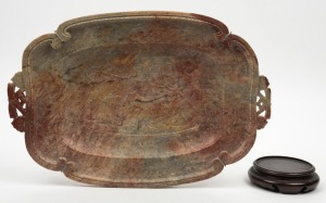A Chinese carved soapstone platter, together with a carved timber stand, 20th century, the platter 39cm across the handles