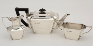 A three piece sterling silver tea service, by William Hutton & Sons of London, circa 1894, 9.5cm high, 390 grams total including wooden handle and finial