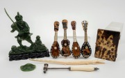 Chinese carved jade statue, doctor's hammer, African carved ivory crocodile ornament, tortoiseshell card case, and four miniature musical instrument ornaments, 19th and 20th century, (8 items), ​​​​​​​the crocodile 26cm long