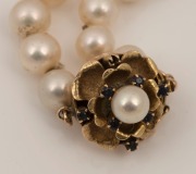 A cultured pearl necklace with 14ct gold clasp, set with blue sapphires and pearl, stamped "14k", 90cm long - 2