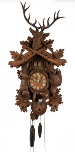 Black Forest vintage cuckoo wall clock with three weights movement and music box mechanism, in a hunter style case, 20th century, 76cm high