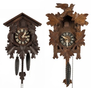 Two vintage Black Forest wall clocks with twin weight movements, 20th century, (one missing crest), the larger 32cm high