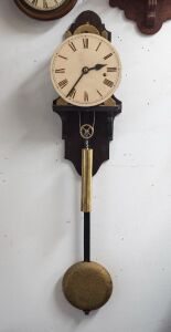 An antique English skeletonized regulator wall clock with deadbeat escapement maintaining power, wood rod pendulum with heavy cast iron bob, one piece painted dial with blued steel spade hands and unassociated brass cased weight, 19th century, custom made later wall bracket, 120cm high