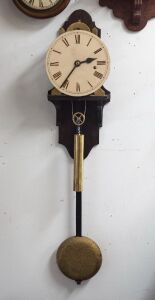 An antique English skeletonized regulator wall clock with deadbeat escapement maintaining power, wood rod pendulum with heavy cast iron bob, one piece painted dial with blued steel spade hands and unassociated brass cased weight, 19th century, custom made