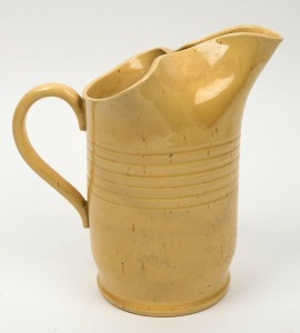 REMUED yellow glazed pottery jug, incised "Remued, 72", 22.5cm high