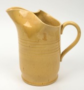 REMUED yellow glazed pottery jug, incised "Remued, 72", 22.5cm high - 2