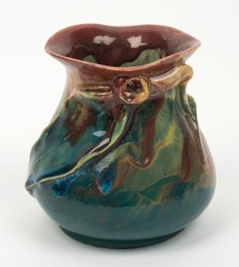 REMUED pottery vase with applied gumnut and leaf, glazed in pink, green and blue, incised "Remued, 1934", 13cm high