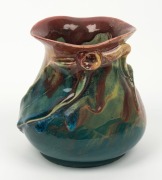 REMUED pottery vase with applied gumnut and leaf, glazed in pink, green and blue, incised "Remued, 1934", 13cm high