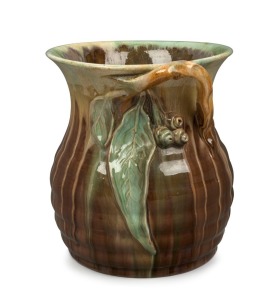 REMUED pottery vase with applied gumnuts and leave, glazed in green and brown, incised "Remued, Hand Made, 191/8M", 21cm high