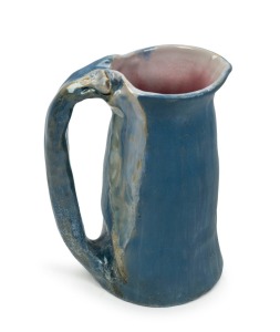 PHILIPPA JAMES pottery jug with applied gumnuts and leaf, glazed in blue with pink interior, incised "Philippa James" 15.5cm high,