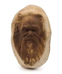 WILLIAM RICKETTS wall mounted pottery face plaque of an Aboriginal elder, reverse adorned with young face, incised "Wm. Ricketts", with remains of pencil inscription 19cm high
