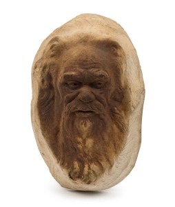 WILLIAM RICKETTS wall mounted pottery face plaque of an Aboriginal elder, reverse adorned with young face, incised "Wm. Ricketts", with remains of pencil inscription 19cm high