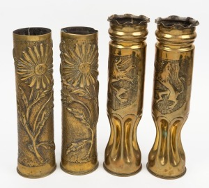 TRENCH ART two pairs of vases with repousse decoration, 34cm and 31cm high