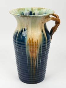 REMUED tall blue glazed pottery vase with branch handle, incised "Remued, 214/12", 31cm high