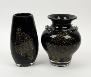 Two black art glass vases with gold foil inclusions,  ​​​​​​​25cm and 24cm high.