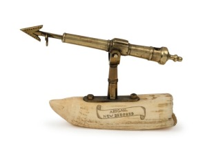 "ABIGAIL NEW BEDFORD" desk ornament paperweight in the form of a whaler's harpoon, mounted on whale's tooth, 10cm high, 15cm wide