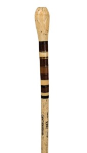 An antique whalebone walking stick with Australian sample wood timber segments and whale tooth handle, 19th century, with later engraving "M.A.d. Avanzo, Queensland, 1925", 84cm high