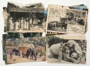 Postcards: BRITISH EMPIRE - CEYLON: A collection of photographic postcards featuring street views of Colombo and surrounding villages, elephants at work, tea industry activities, manicured gardens, traditional agricultural and religious practices, etc.&nbsp;(T - 3