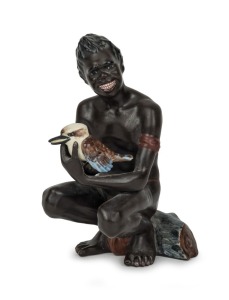 DARBYSHIRE ceramic statue of a crouching Aboriginal man holding a kookaburra, rare, impressed factory mark to base, 16cm high