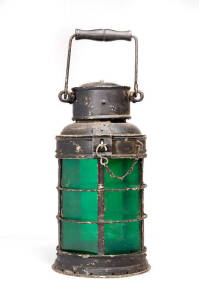 SIGNAL LAMP: Cylindrical form with 6 green glass lenses, early 20th century. 35cm