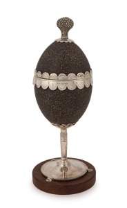 An antique sterling silver emu egg inkwell, adorned with wheatsheaf finial (note: later wooden base), made in London, circa 1886, 24cm high