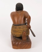 A carved statue of a crouching Maori warrior with taiaha and full Tā moko, 20th century, 20.1cm high - 4