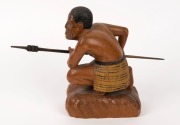 A carved statue of a crouching Maori warrior with taiaha and full Tā moko, 20th century, 20.1cm high - 5